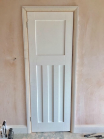 Panelled door and architrave